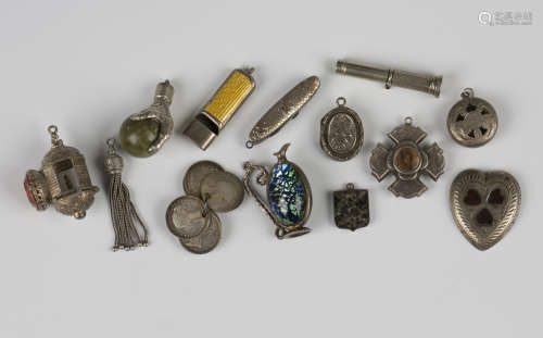 Five silver pendants and charms, including a cruciform compa...