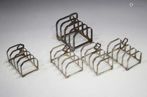 A set of three Elizabeth II silver four-division toast racks...