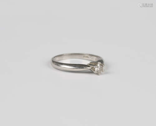 A platinum and diamond single stone ring, claw set with a ci...
