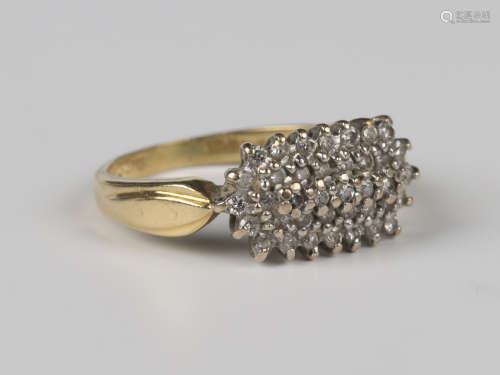 An 18ct gold and diamond cluster ring, mounted with circular...