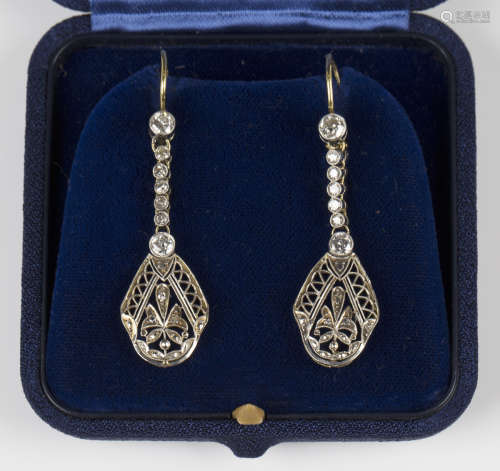 A pair of diamond pendant earrings, each drop of pierced fol...