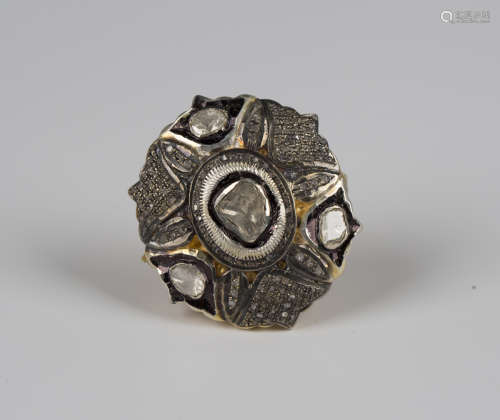 An Indian silver gilt and diamond ring of large shaped oval ...