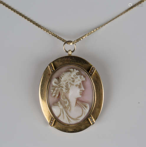 A gold mounted, carved pink shell cameo pendant, designed as...