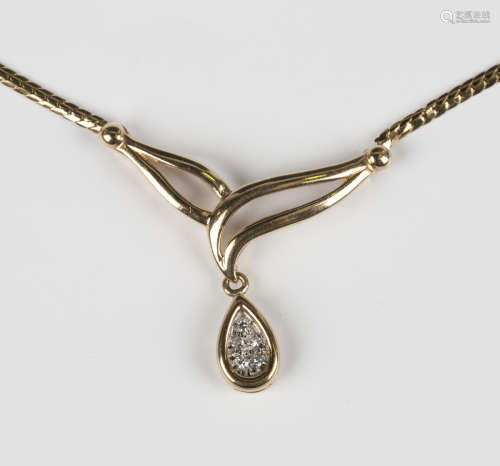 A 9ct gold and diamond pendant necklace, the front in an ope...