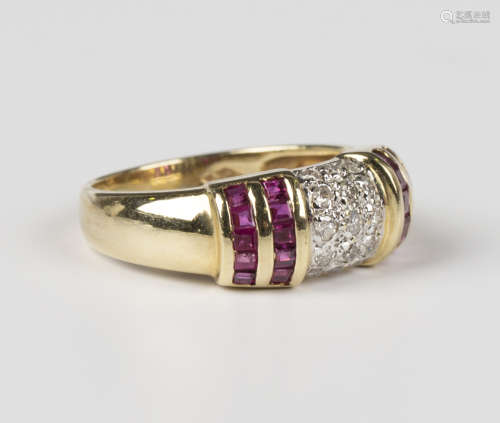 A gold, diamond and ruby ring in a domed design, mounted wit...