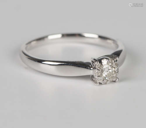A 9ct white gold and diamond cluster ring, mounted with the ...