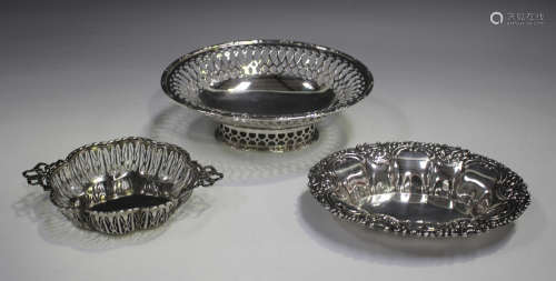 A George V silver oval footed bonbon dish with pierced sides...