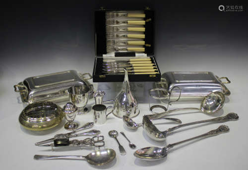 A collection of plated items, including a wine funnel, a pai...