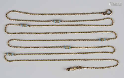 A gold and pale blue enamel long guard chain in a ropetwist ...