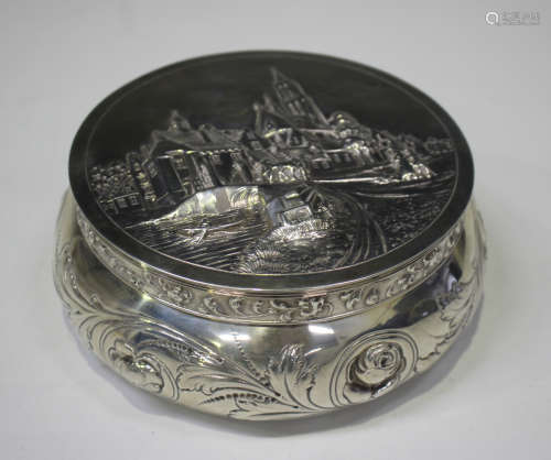 An early 20th century Dutch silver circular box with hinged ...
