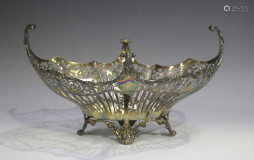 A George V silver boat shaped basket with pierced garland an...