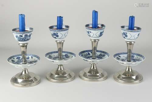 Four plated candlesticks