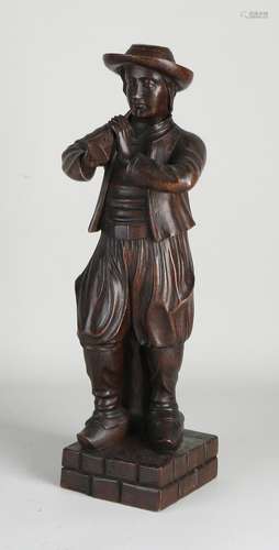 Wooden figure, Man with wind instrument