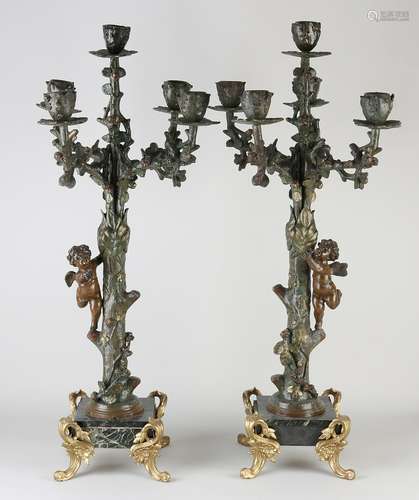 Two candlesticks with putti