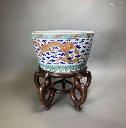 A CHINESE 'DRAGON' JARDINIERE WITH STAND