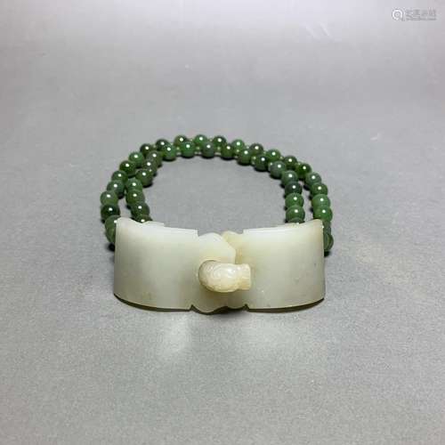 A WHITE JADE AND JADEITE BELT BUCKLE