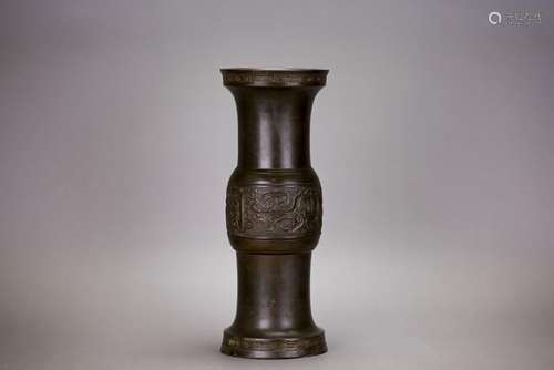 A CHINESE BRONZE BEAKER VASE