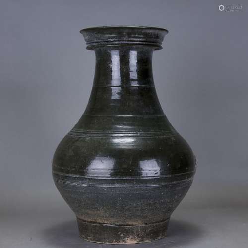 A GREEN-GLAZED POTTERY JAR