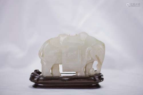 A CHINESE WHITE JADE CARVING OF ELEPHANT WITH STAND