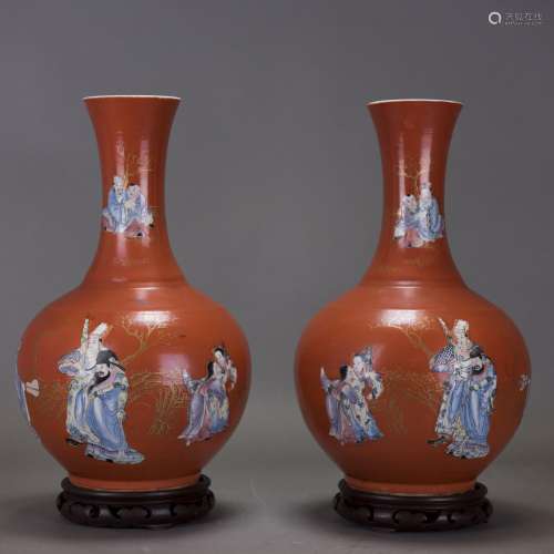 A PAIR OF CORAL-RED-GROUND FAMILLE ROSE BOTTLE VAS…
