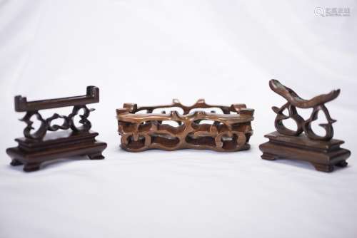 A GROUP OF THREE WOODEN STAND