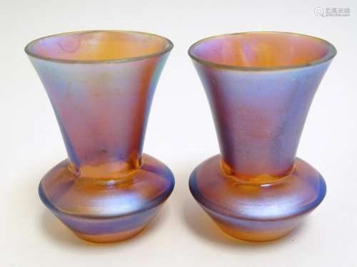 Two small iridescent glass vases in the manner of Myra