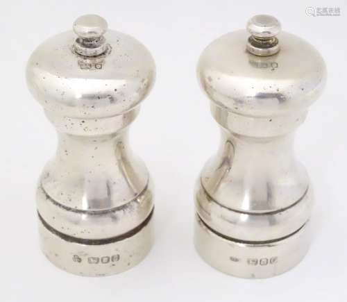 Two silver pepper mills / grinders hallmarked London