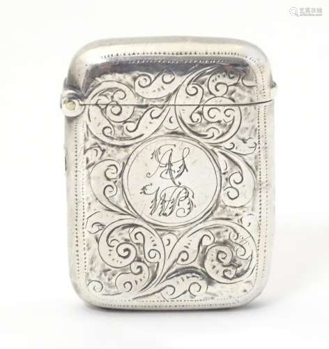 A silver vesta case with engraved decoration,