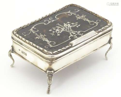 A silver ring box with tortoiseshell lid having pique