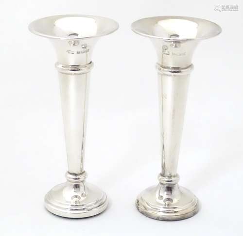 A pair of silver bud vases hallmarked Birmingham 1974,