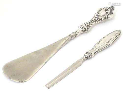 A silver handled shoe horn, together with a silver