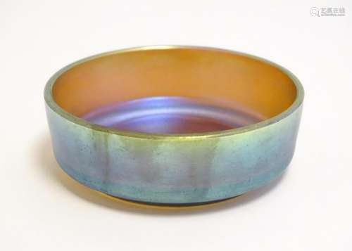 A small iridescent glass dish in the manner of Myra