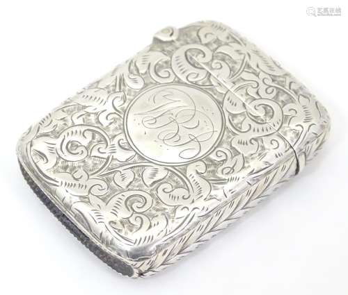 A Victorian silver vesta case with engraved decoration,
