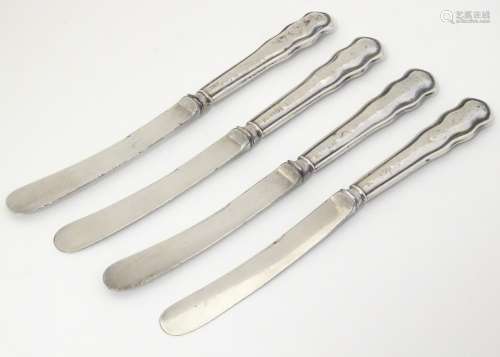 A set of 4 silver handled butter knives hallmarked
