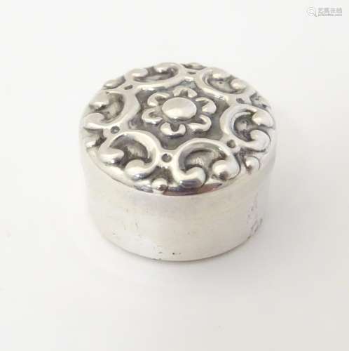 A Spanish silver pill box with C-scroll detail to top.