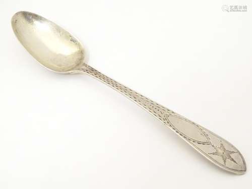 An Irish silver teaspoon. hallmarked Dublin 1900, maker