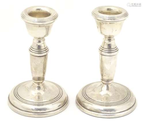 A pair of silver candlesticks hallmarked 1971, maker B