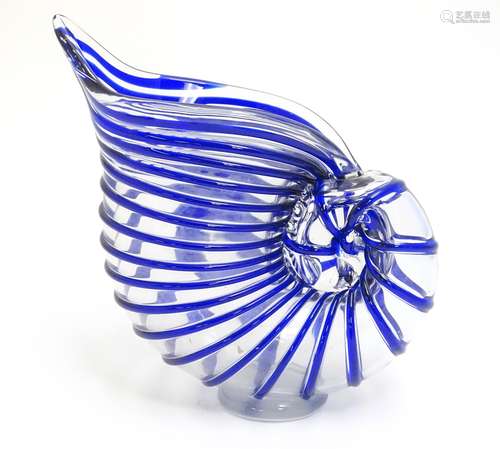 A studio glass jug formed as a stylised nautilus shell,