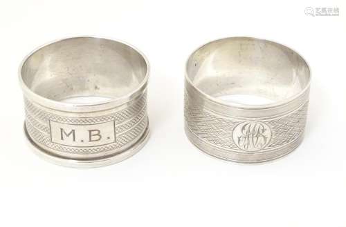Two silver napkin rings both with engine turned