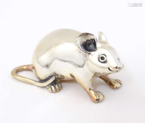 A white metal model of a mouse. 1 1/2