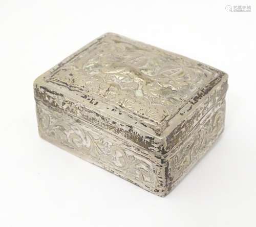 A white metal box with stylised big cat decoration.