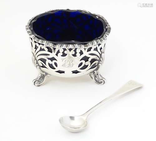 A Victorian silver mustard with blue glass liner,