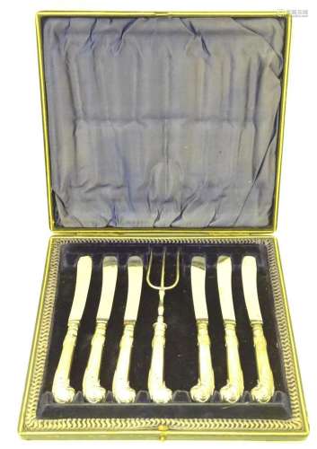 A cased set of tea knives and fork with silver pistol