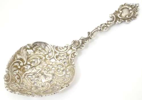 A Victorian silver sifter spoon with cast decoration