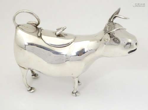 A 19thC Continental silver cow creamer with import