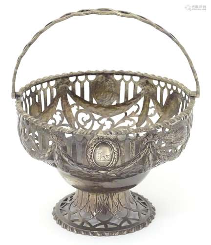 A 19thC white metal basket of pedestal form with