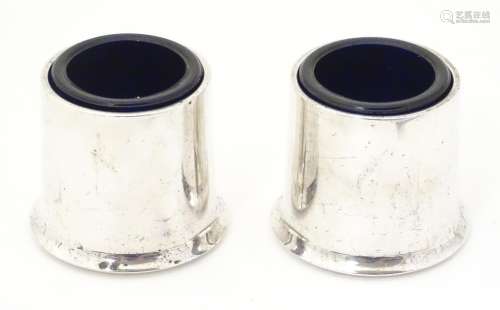 A late 20thC pair of silver plate salts with blue glass