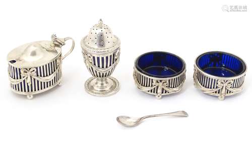 A four piece silver cruet, comprising a pair of salts,