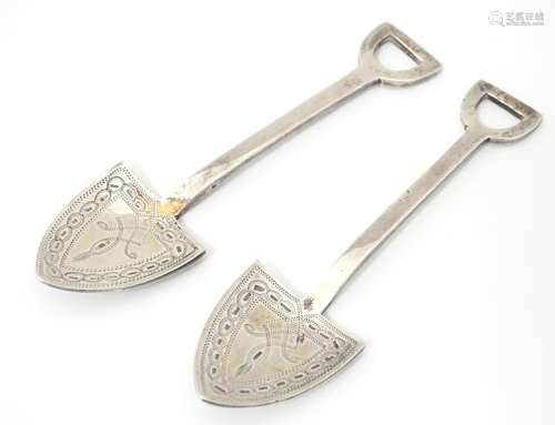 A pair of novelty silver plate salt spoons formed as