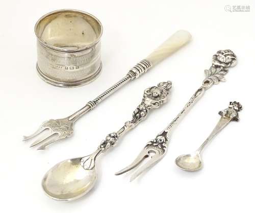 Five assorted silver items to include a napkin ring,